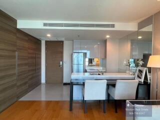 Modern and spacious living room with dining area and attached kitchen