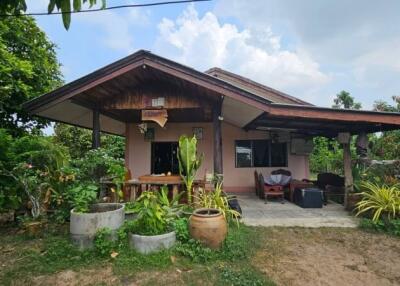 Front view of a single-story house with a spacious yard