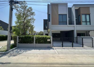 Modern two-story residential townhouse with front gate
