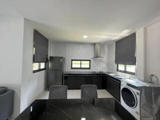 Modern kitchen with glossy cabinets and integrated appliances