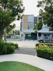 Modern two-story house with landscaped front yard