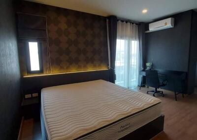 Elegant bedroom with modern design and dark tones