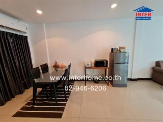 Spacious living room with dining area and kitchenette