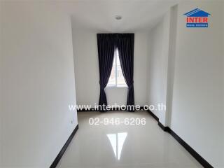 Bright and minimalist bedroom with large window and navy curtains