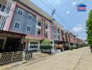 Modern residential townhouses facade with parking spaces