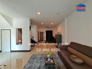 Modern living room interior with staircase leading to upper floor