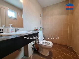 Spacious bathroom with modern fixtures and neutral tile design