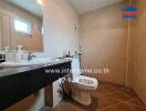 Spacious bathroom with modern fixtures and neutral tile design