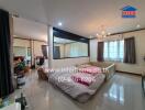 Spacious bedroom with large bed and mirror