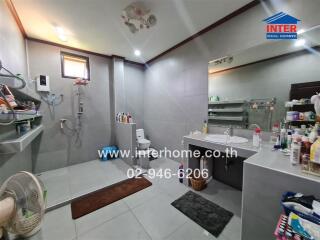 Spacious modern bathroom with ample lighting and double vanity