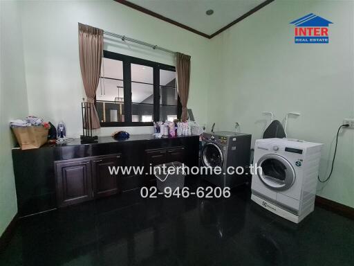 Spacious kitchen with modern appliances and ample storage