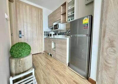 Modern kitchen with stainless steel appliances and wooden cabinets