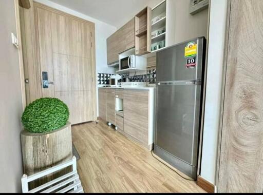 Modern kitchen with stainless steel appliances and wooden cabinets