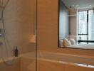 Modern bathroom with view to a bedroom in a high-rise apartment