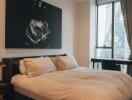 Modern bedroom with large window and artistic wall art