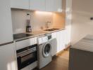 Modern kitchen with integrated appliances and neat wooden finish