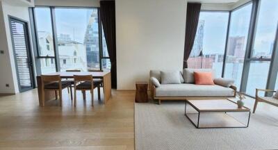 Spacious living room with large windows and city view