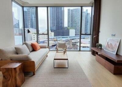 Modern living room with city skyline view through large windows