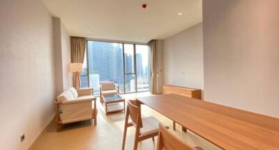 Spacious and well-lit living room with city view