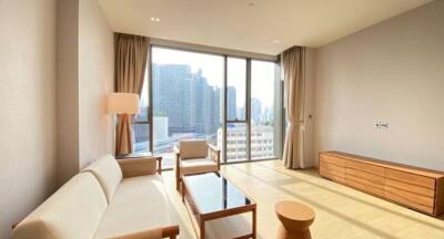 Modern living room with large windows and city view