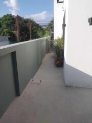 Spacious balcony with scenic view and greenery