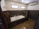Spacious modern bathroom with jacuzzi tub and elegant tiling