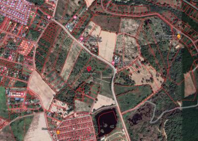 Aerial view of a developing area with roads and plots