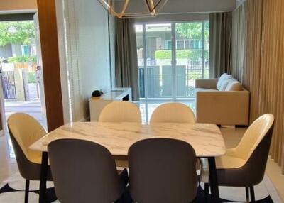 Elegant dining room interior with modern furniture and stylish lighting