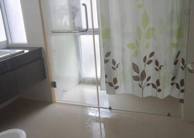 Modern bathroom with glass shower enclosure and elegant design