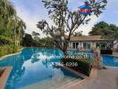 Spacious outdoor swimming pool with surrounding patio and lush garden in a residential property