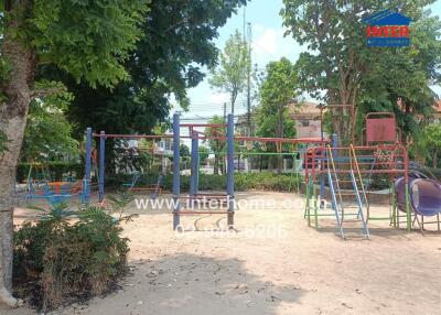 Colorful outdoor playground surrounded by greenery