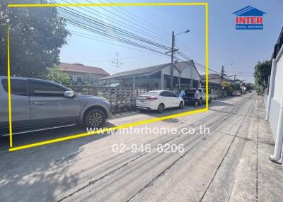 Street view of residential area with parked cars