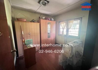 Spacious bedroom with natural lighting and ample storage
