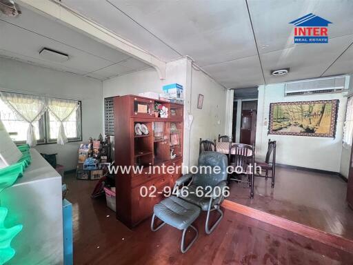 Spacious living room with natural lighting and traditional decor