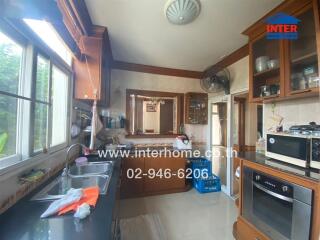 Spacious kitchen with modern appliances and ample natural light