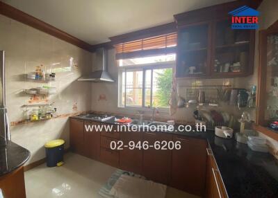 Spacious kitchen with natural lighting and modern appliances