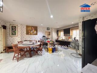 Spacious kitchen and dining area with modern appliances and elegant design