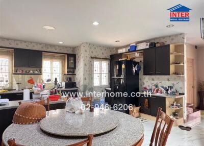 Spacious kitchen with modern appliances and a central dining area