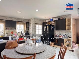 Spacious kitchen with modern appliances and a central dining area