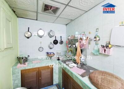Compact urban kitchen with utensils and appliances