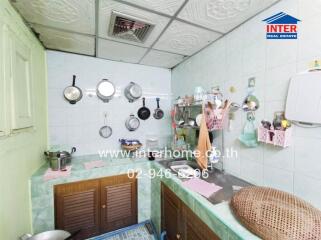 Compact urban kitchen with utensils and appliances