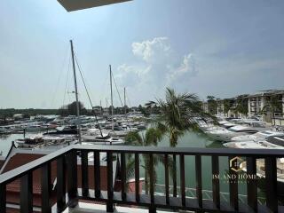 Luxurious balcony view overlooking a marina with numerous boats