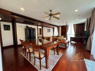 Spacious living room with dining area and hardwood floors