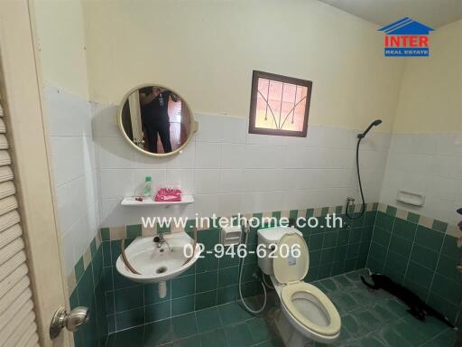 Bright and functional bathroom with white and blue tiles