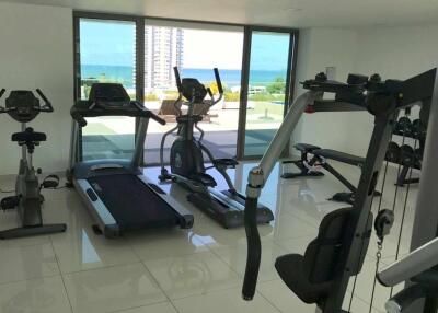 Well-equipped residential gym with ocean view