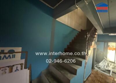 view of a modern staircase in a home with blue walls