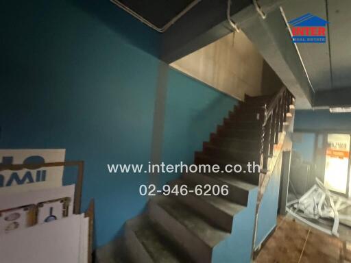 view of a modern staircase in a home with blue walls