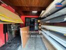 Spacious storage room with wooden ceiling and organized shelving