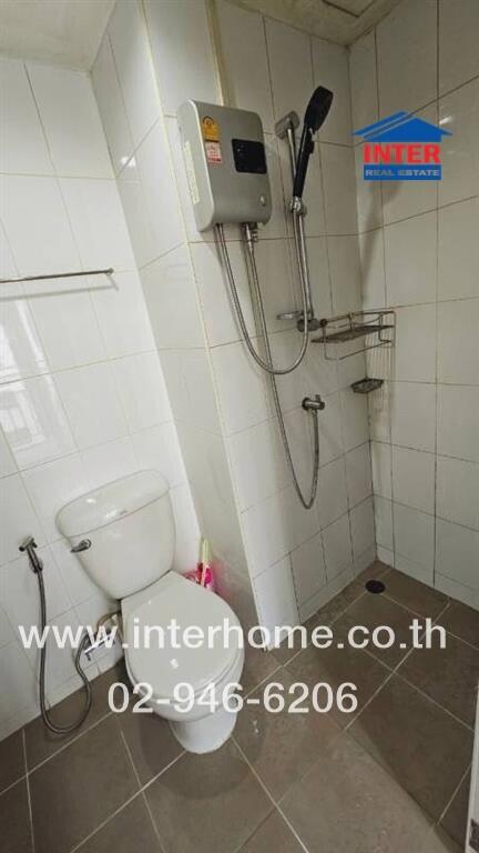 Modern bathroom with white tiles and water heater