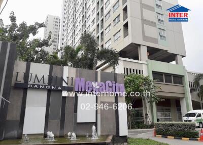Exterior view of Lumini Megacity Bangna residential building with signage